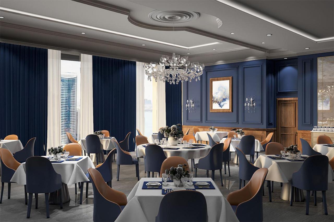 The Bentley Luxury Hotel & Suites Doha Exterior foto The interior of the restaurant
